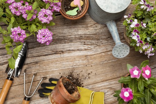 A gardener reviewing a service complaint and taking notes
