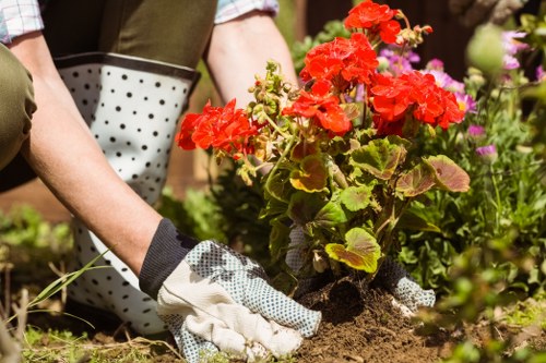 Worker managing gardening tasks with awareness of safety controls